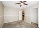 This bedroom features carpet, neutral walls, and a door looking into the kitchen at 3751 Crellin Cir, Las Vegas, NV 89120