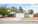 Inviting single-story home with a two-car garage, complemented by mature trees at 3751 Crellin Cir, Las Vegas, NV 89120