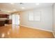 Open-concept living and dining area with hardwood floors and access to the kitchen at 3751 Crellin Cir, Las Vegas, NV 89120