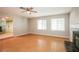Bright living room featuring hardwood floors, a fireplace, and ample natural light from large windows at 3751 Crellin Cir, Las Vegas, NV 89120
