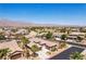 Aerial view of a single-story home in a well-planned community with mountain views in the background at 3904 Redbreast Ln, North Las Vegas, NV 89084