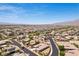 Sprawling aerial shot of a well-planned community with neatly arranged homes and a clear blue sky at 3904 Redbreast Ln, North Las Vegas, NV 89084