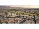 Panoramic aerial view of the community showcasing lush green spaces, well-maintained homes and mountain views at 3904 Redbreast Ln, North Las Vegas, NV 89084