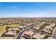 Vast aerial image of a community, showing a mix of housing styles and mountain range in the background at 3904 Redbreast Ln, North Las Vegas, NV 89084