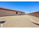 Spacious backyard featuring rock landscaping, a brick perimeter fence, and low maintenance design at 3904 Redbreast Ln, North Las Vegas, NV 89084