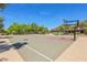 Community basketball court with clear blue skies, mature landscaping and striping for recreational fun at 3904 Redbreast Ln, North Las Vegas, NV 89084