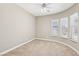 Bright bedroom with neutral walls and carpet and a ceiling fan at 3904 Redbreast Ln, North Las Vegas, NV 89084