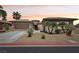 Charming single-story home featuring a three-car garage, desert landscaping, and a cozy front entrance at 3904 Redbreast Ln, North Las Vegas, NV 89084