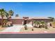 Single-story home boasts manicured landscaping, a three-car garage, and a neutral color scheme at 3904 Redbreast Ln, North Las Vegas, NV 89084
