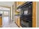 Kitchen view featuring built-in oven and microwave, granite countertops and an open floor plan at 3904 Redbreast Ln, North Las Vegas, NV 89084