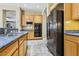 Well-equipped kitchen with stainless steel appliances, a built-in microwave, and granite countertops at 3904 Redbreast Ln, North Las Vegas, NV 89084
