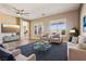 Inviting living room featuring a ceiling fan, comfortable furniture, and stylish decor at 3904 Redbreast Ln, North Las Vegas, NV 89084