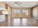 Spacious living room with tile flooring, neutral walls, and bright, natural light at 3904 Redbreast Ln, North Las Vegas, NV 89084