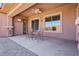 Relaxing outdoor patio with a ceiling fan, perfect for enjoying the serene backyard setting at 3904 Redbreast Ln, North Las Vegas, NV 89084