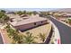 Exterior shot of a home featuring desert landscaping and a neatly maintained backyard at 3904 Redbreast Ln, North Las Vegas, NV 89084