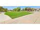 Well-maintained green turf area surrounded by landscaping, benches, and seating, perfect for outdoor relaxation at 3904 Redbreast Ln, North Las Vegas, NV 89084