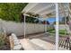Backyard featuring an outdoor living area with a pergola, privacy fencing and manicured landscaping at 4052 Compass Rose Way, Las Vegas, NV 89108