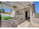 Backyard featuring an outdoor living area with a pergola, artificial grass, and privacy fencing at 4052 Compass Rose Way, Las Vegas, NV 89108