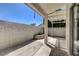 Backyard with block wall, artificial grass, pergola, and manicured landscaping at 4052 Compass Rose Way, Las Vegas, NV 89108