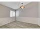Inviting dining area featuring wood-look tile flooring and stylish lighting at 4052 Compass Rose Way, Las Vegas, NV 89108