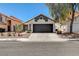 Charming single-story home with a two car garage and well-manicured desert landscaping at 4052 Compass Rose Way, Las Vegas, NV 89108