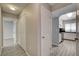 Hallway features white doors and tile floors, and leads to kitchen at 4052 Compass Rose Way, Las Vegas, NV 89108