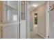 Hallway with built in storage cabinet and leading to the bathroom at 4052 Compass Rose Way, Las Vegas, NV 89108
