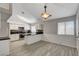 Bright kitchen with white cabinets, granite countertops, and stainless steel appliances at 4052 Compass Rose Way, Las Vegas, NV 89108
