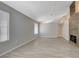 Spacious living area with an accent stone fireplace and lots of natural light at 4052 Compass Rose Way, Las Vegas, NV 89108
