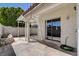Enclosed patio with a concrete floor, a sunshade cover, and a small garden bed at 4052 Compass Rose Way, Las Vegas, NV 89108