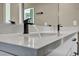 This bathroom has a double sink vanity with modern black faucets and fixtures, and a large mirror at 460 Pear Lake St, Las Vegas, NV 89138