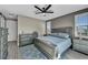 Main bedroom featuring neutral tones, a king bed, and dresser with natural light from windows at 460 Pear Lake St, Las Vegas, NV 89138
