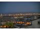 Night view of Las Vegas skyline from a residential neighborhood, showcasing the city lights and mountain backdrop at 460 Pear Lake St, Las Vegas, NV 89138
