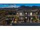Modern two-story home with desert landscaping, covered porches, and mountain backdrop at 460 Pear Lake St, Las Vegas, NV 89138