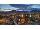 Beautiful two-story home with outdoor seating area and landscaped yard, nestled against a mountain backdrop at 460 Pear Lake St, Las Vegas, NV 89138