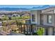 Home featuring stone accents, a patio, and mountain views in the distance at 460 Pear Lake St, Las Vegas, NV 89138