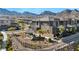 A beautiful, modern, gray home with a covered picnic area, and a mountain backdrop at 460 Pear Lake St, Las Vegas, NV 89138