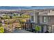 View of modern townhouse with manicured front yard, stone detail, and patio seating area in a community at 460 Pear Lake St, Las Vegas, NV 89138