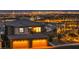 Spectacular home showcasing illuminated city views, balcony, and two-car garage at 460 Pear Lake St, Las Vegas, NV 89138