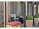 Comfortable seating on a covered porch with stylish decor and shade at 460 Pear Lake St, Las Vegas, NV 89138