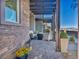 Beautiful front porch with stone flooring and elegant outdoor furniture at 460 Pear Lake St, Las Vegas, NV 89138
