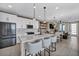 Bright, open kitchen with white cabinets, an island, and stainless steel appliances at 460 Pear Lake St, Las Vegas, NV 89138
