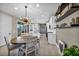 Eat-in kitchen with chandelier lighting and access to the outdoor living space at 460 Pear Lake St, Las Vegas, NV 89138