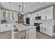 Bright, modern kitchen with white cabinetry, stainless appliances, and island seating at 460 Pear Lake St, Las Vegas, NV 89138
