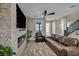 Stylish living room with a stone fireplace and comfortable leather seating at 460 Pear Lake St, Las Vegas, NV 89138