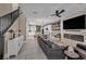 Open living area connecting a modern kitchen with a comfortable living room at 460 Pear Lake St, Las Vegas, NV 89138