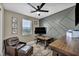 Well-lit office space features a desk, an accent wall, and comfortable seating at 460 Pear Lake St, Las Vegas, NV 89138
