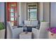 Cozy front porch with seating, a fire pit, and a champagne set at 460 Pear Lake St, Las Vegas, NV 89138