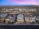 Dusk aerial shot capturing numerous modern homes nestled within a vibrant community at 484 Windstone Crest Ave, Las Vegas, NV 89138