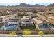 Aerial view showcases modern homes, desert landscaping, and mountain backdrop at 484 Windstone Crest Ave, Las Vegas, NV 89138